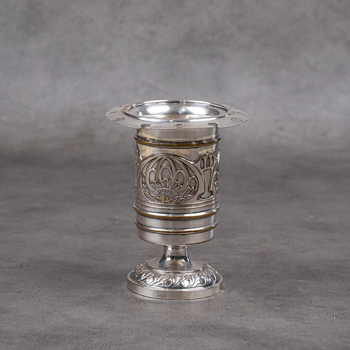 Spoon stand made of silver-plated brass.