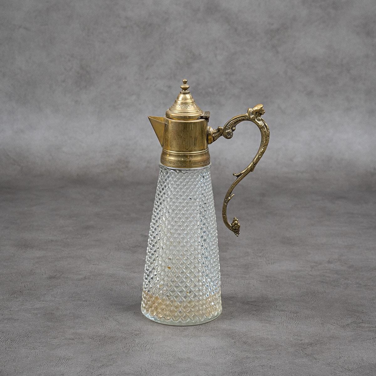 Water or juice pitcher made of brass and crystal glass