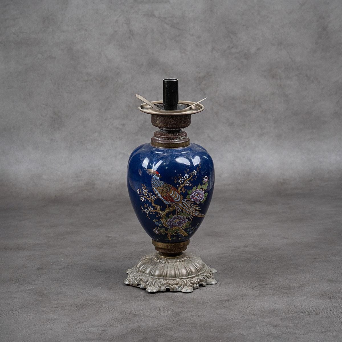 Antique lamp made of brass and porcelain