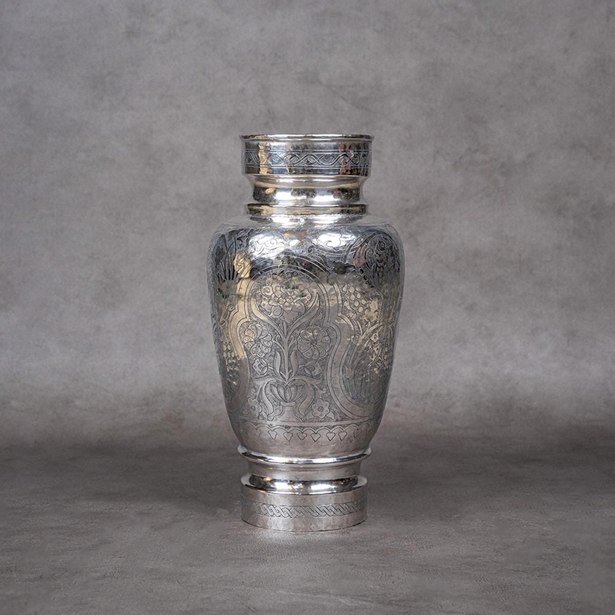 A vase made of brass and covered with silver