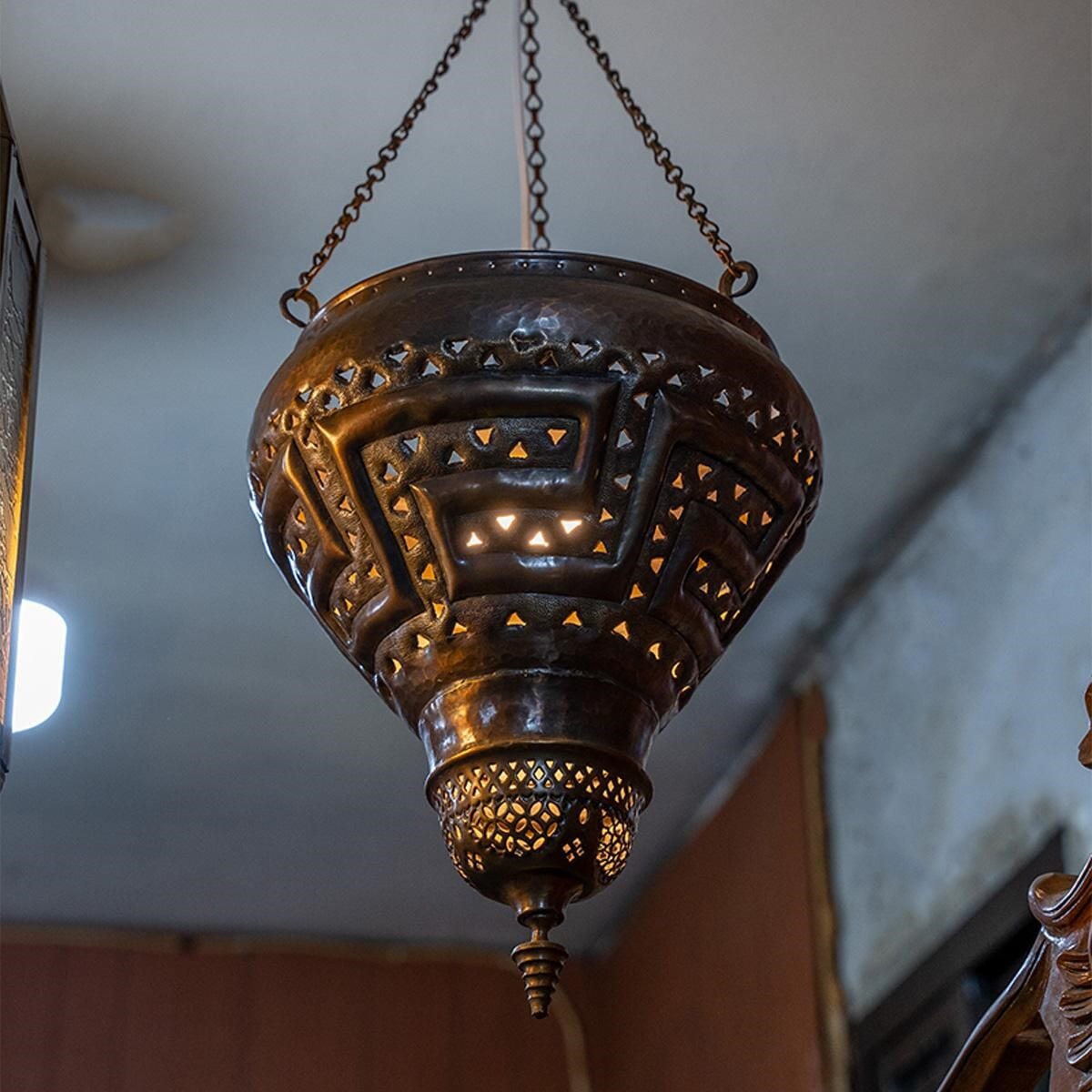 A lamp made of antique red brass