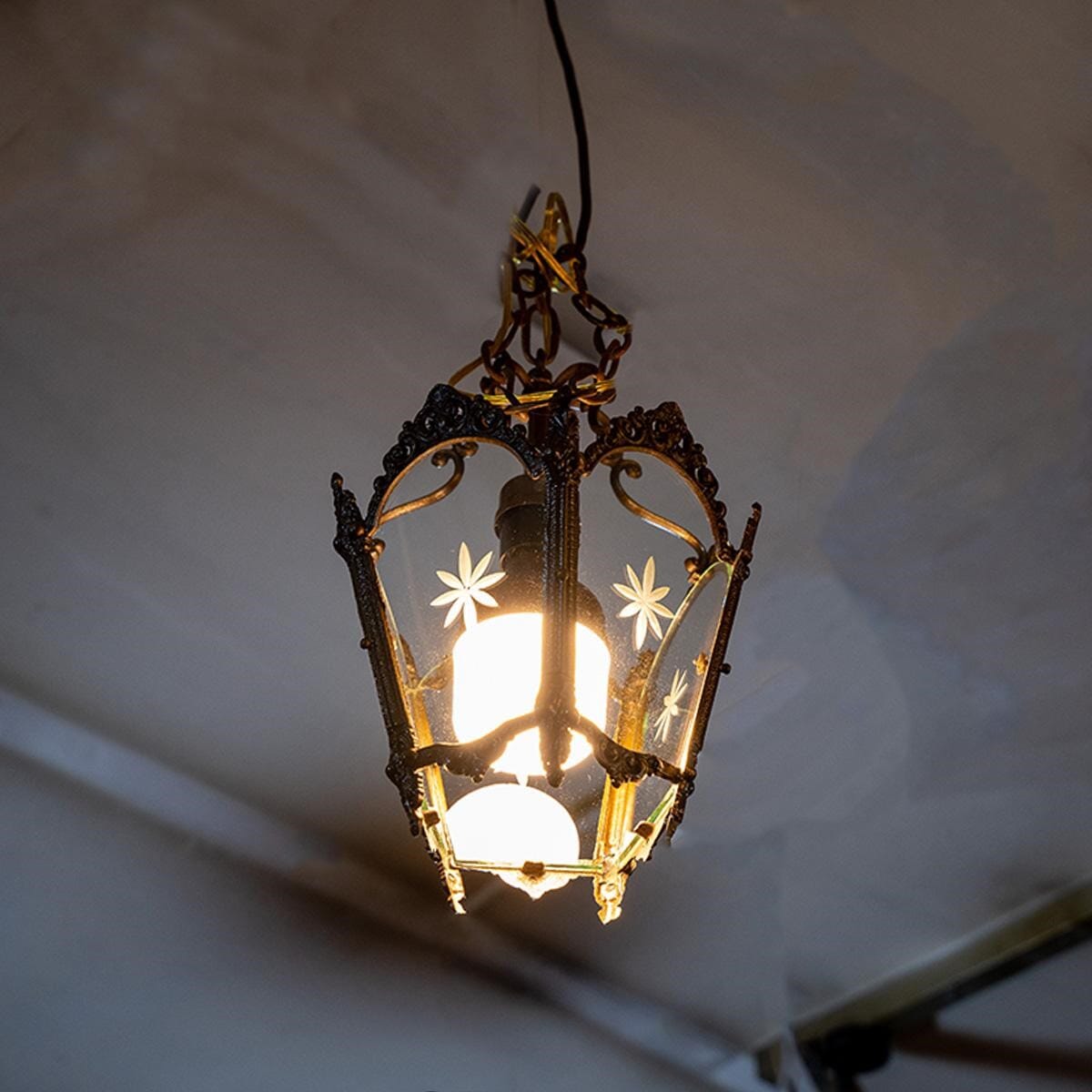 Lantern made of antique brass and clear glass