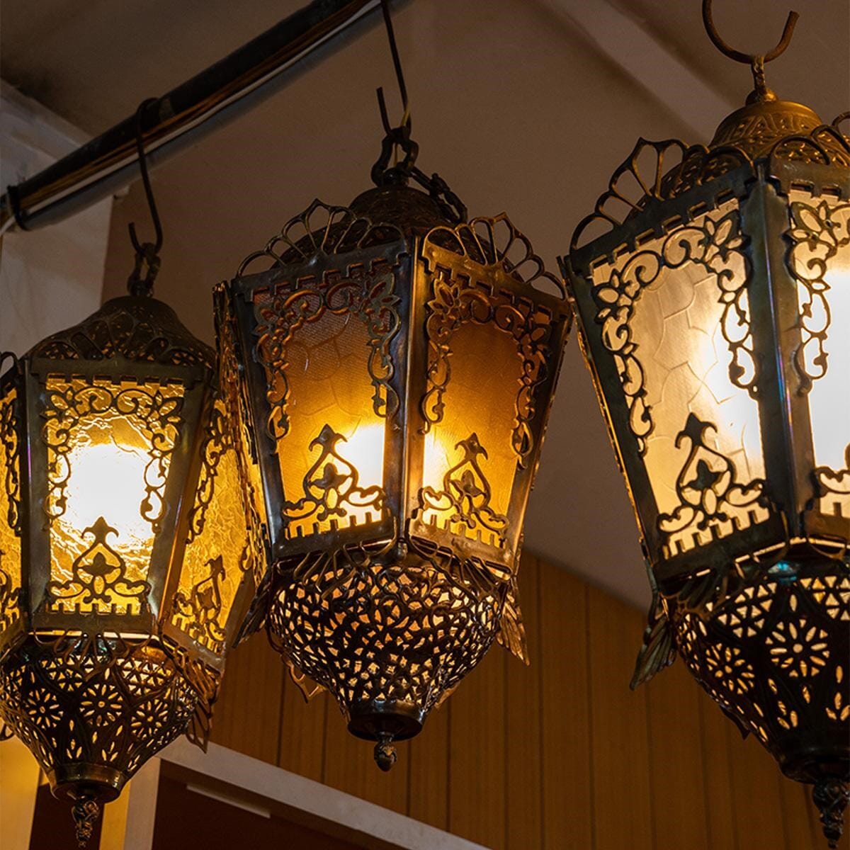 Hexagonal lantern made of brass and stained glass