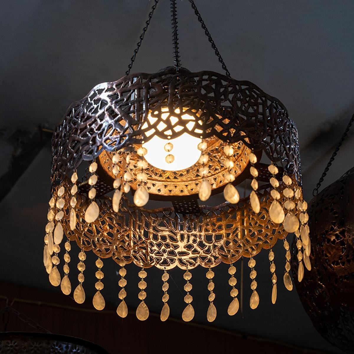 Chandelier made of antique red brass and crystal