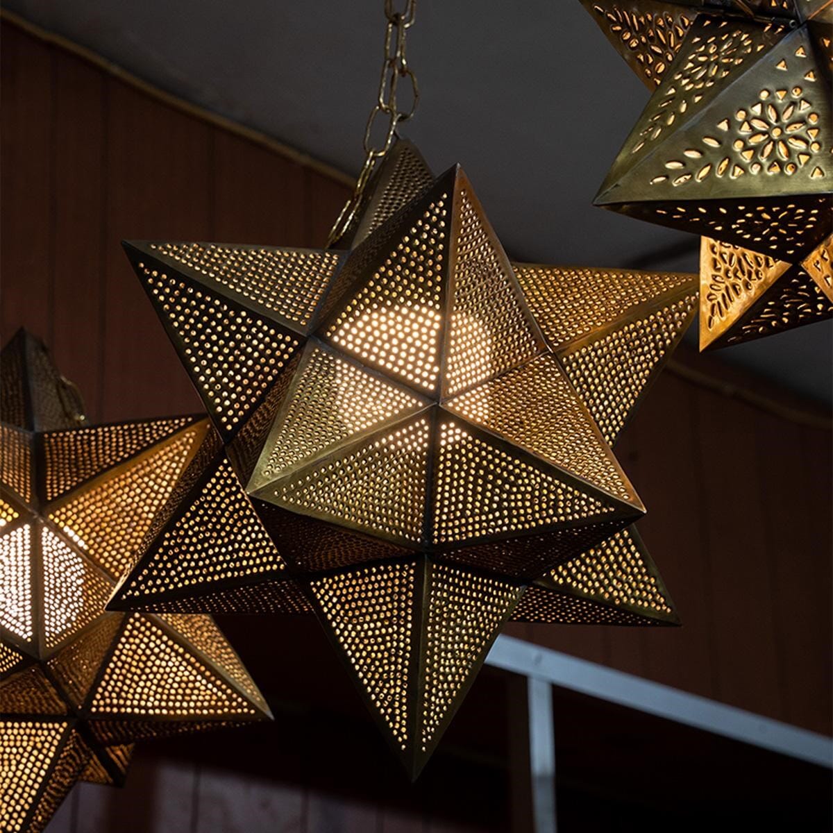 Star-shaped lantern made of brass.