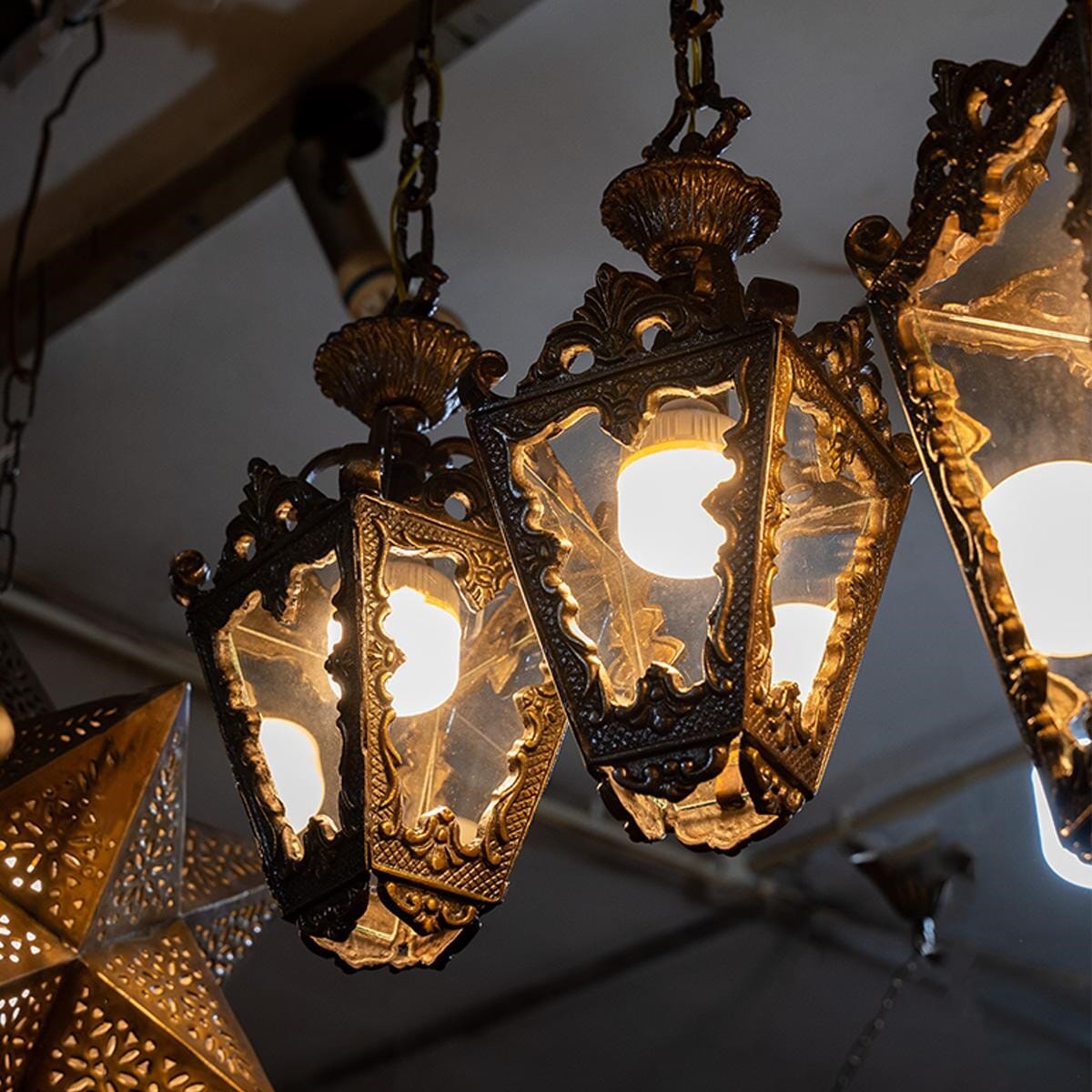 Lantern made of brass and glass. Width 20 cm and height 35 cm.