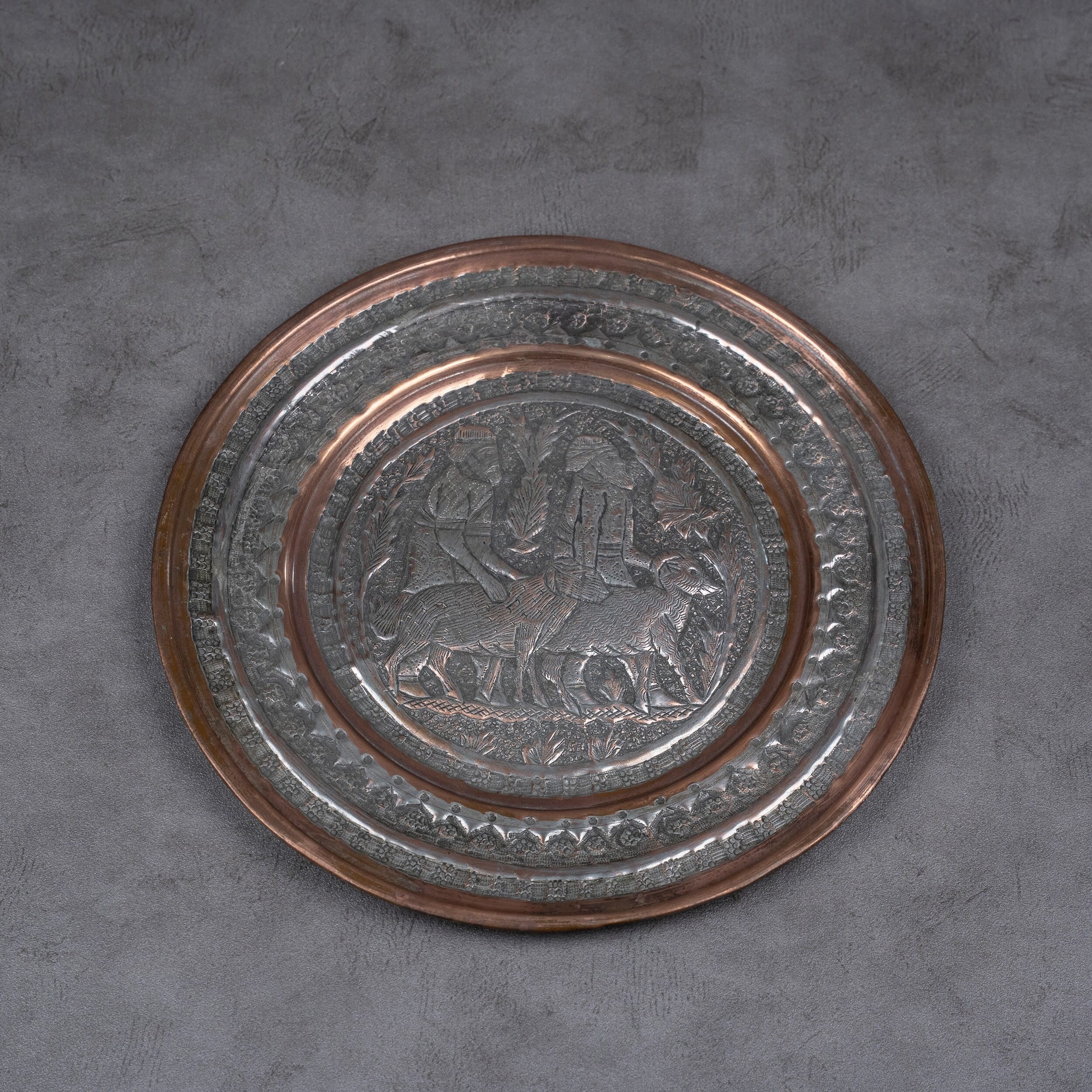 A plate made of red copper and tinned