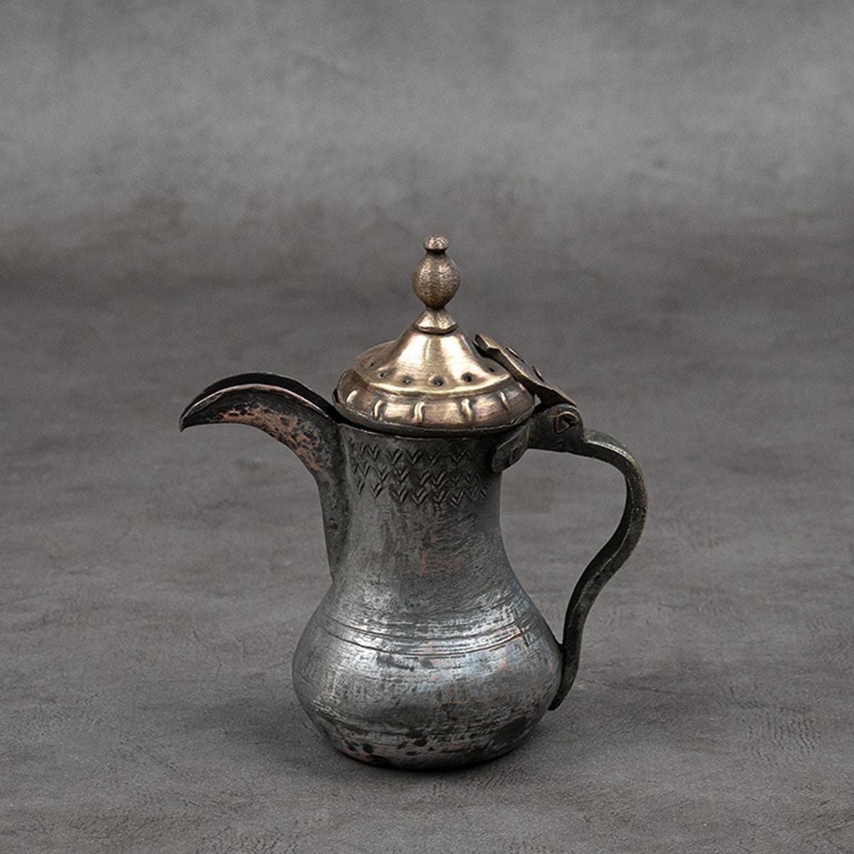 Coffee pot made of red and yellow copper